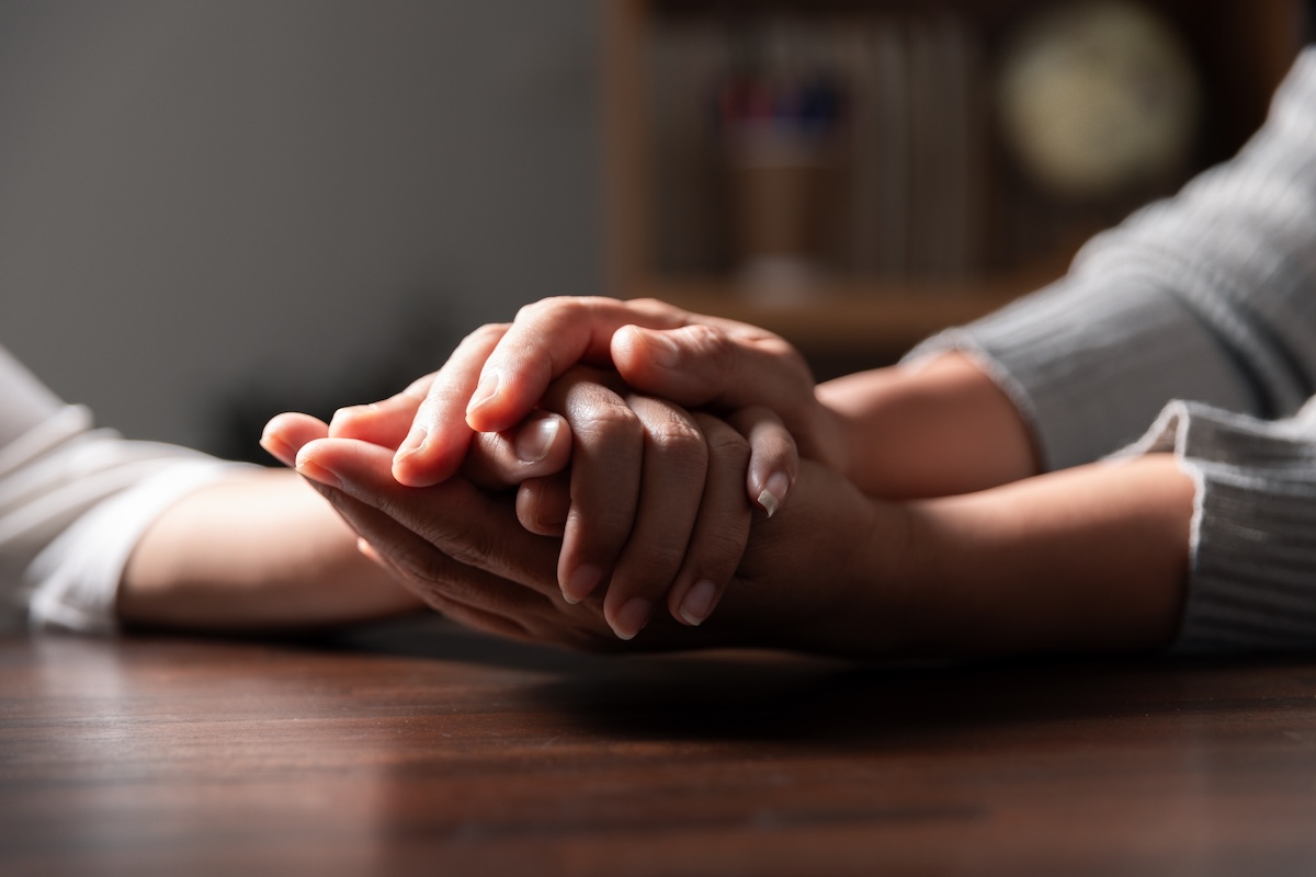 Group of different women praying together, Christians and Bible study concept.